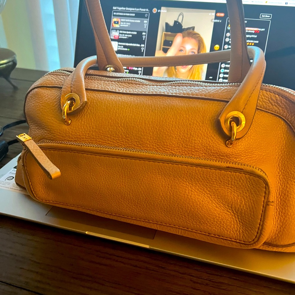 Monsac   hand bag, small but cute. You’ll love it stylish